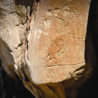Glimpse into the past when you view the sandstone etchings at White Mountain.