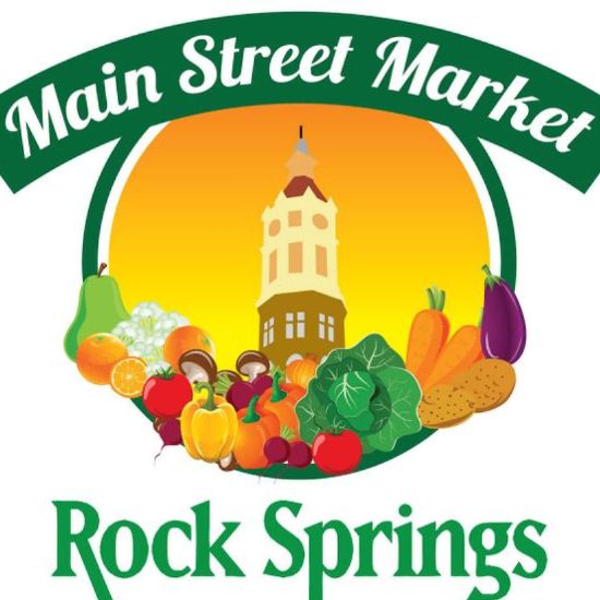 Main Street Market Rock Springs logo with a building, sunset background, and assorted fruits and vegetables in the foreground.