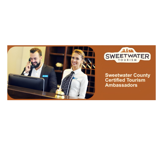 A man and a woman in professional attire stand behind a front desk, with the text “Sweetwater Tourism, Sweetwater County Certified Tourism Ambassadors” displayed to the right.